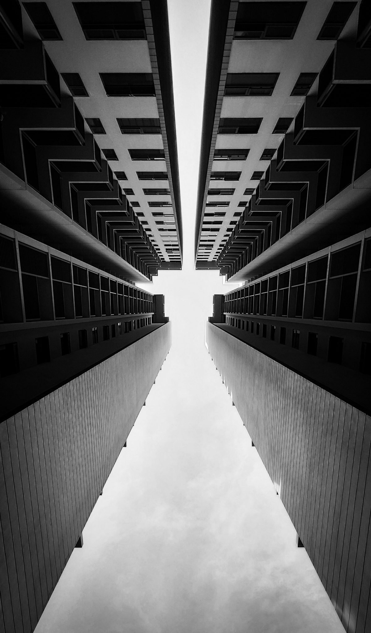 Looking up between two high-rise residential towers